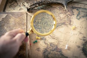 Map of the United States with a magnifying glass