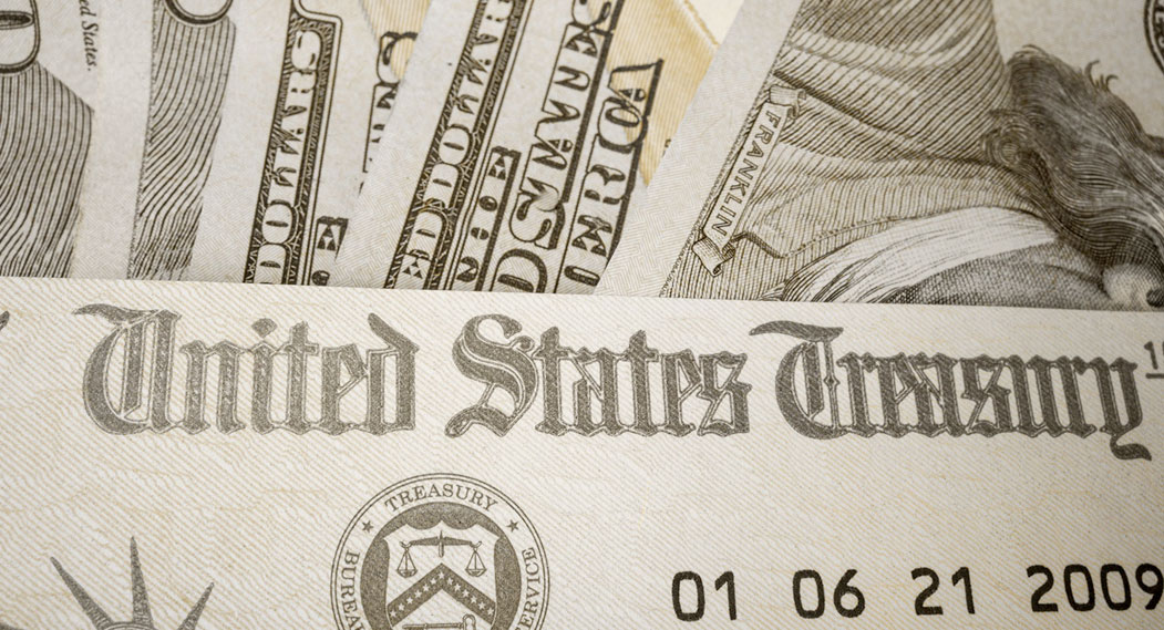 Close-up of United States Currency, representing The Hefty High Price of Attempted Whistleblower Retaliation, SEC, and whistleblower rewards