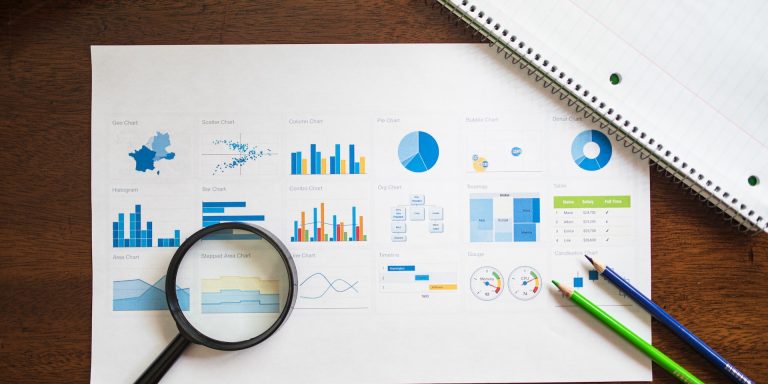 Overhead Shot of a Paper with Graphs and Charts, representing SEC Enforcement Division