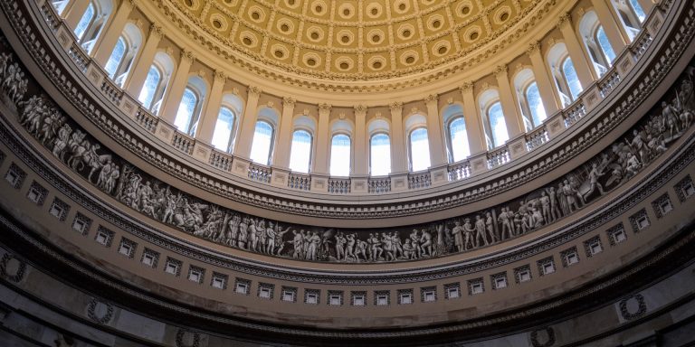 Interior of United States Capitol rotunda with ornamental dome, an image representing US courts and Attorney General Jeff Sessions