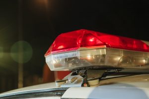 Close-up Photo of Police Siren, representing corporate policing