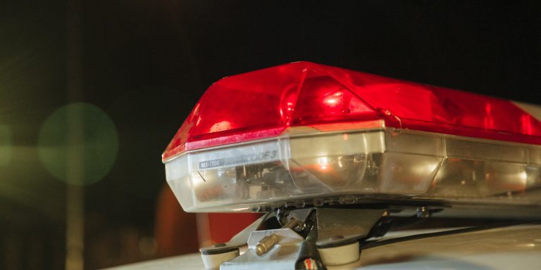 Close-up Photo of Police Siren, representing corporate policing