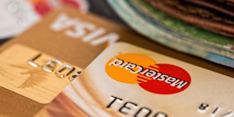 Close-up Photography Two Brown Cards, representing foreign currency