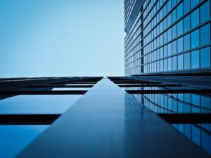 Low Angle View of Office Building Against Clear Sky, representing whistleblower award.