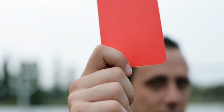 Person Holding Red Card