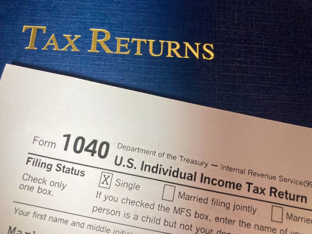 Tax Returns with Portfolio, IRS form 1040 and Cash