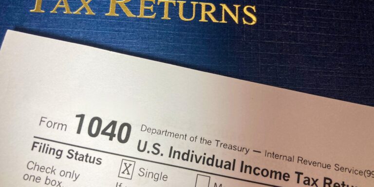 Tax Returns with Portfolio, IRS form 1040 and Cash